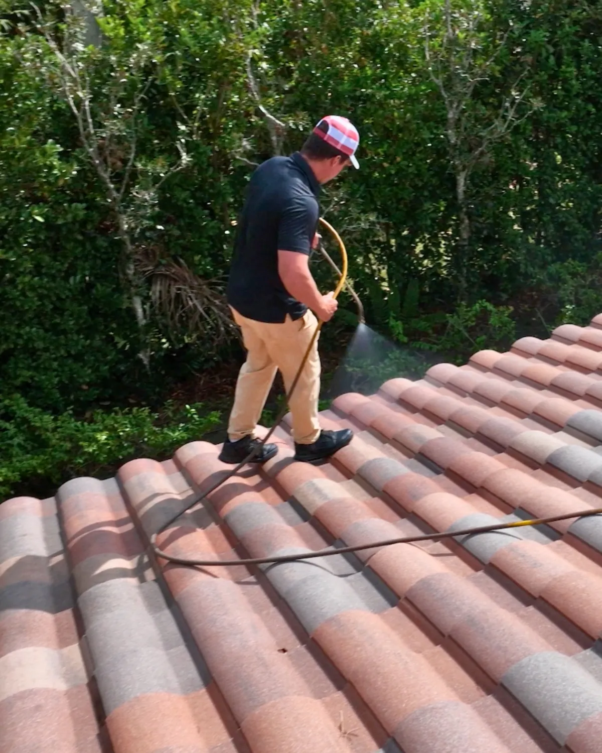 UBA technician applying HydroLock sealer to roof