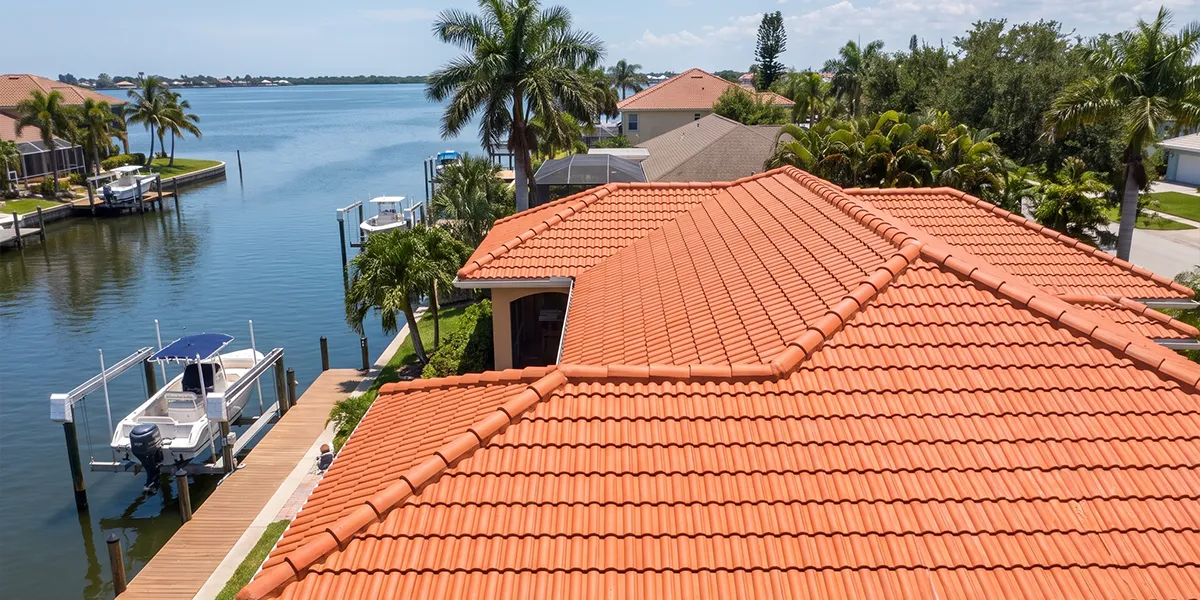 Freshly cleaned tile roof on a Bradenton waterfront home after UBA soft wash roof cleaning