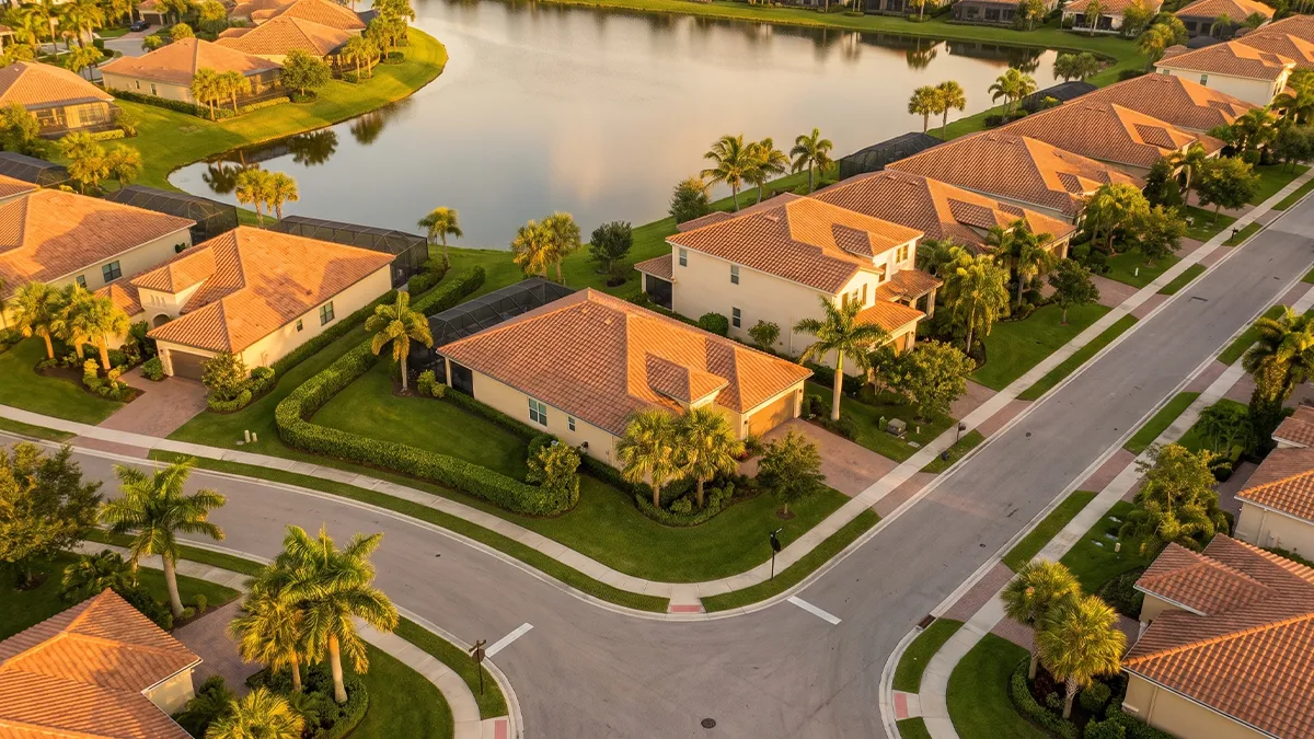 Aerial view of a Lakewood Ranch neighborhood with cleaned tile roofs and paver driveways